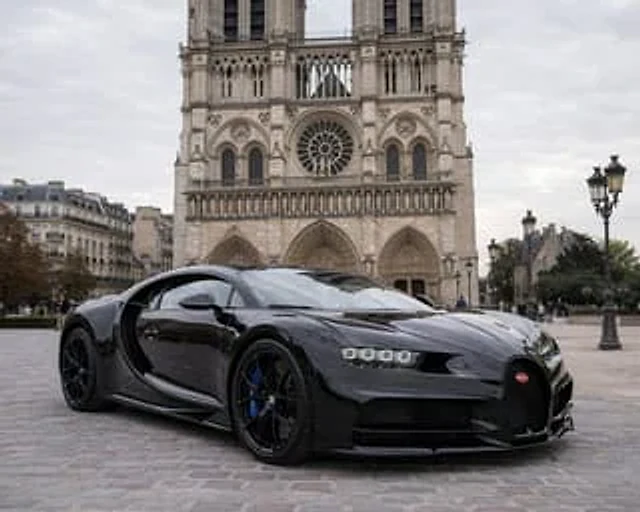 Example generated from “Hypercar Parked Before a Historic Landmark”