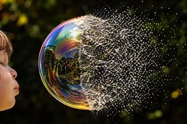Example generated from “Bursting Soap Bubble Macro Photo”